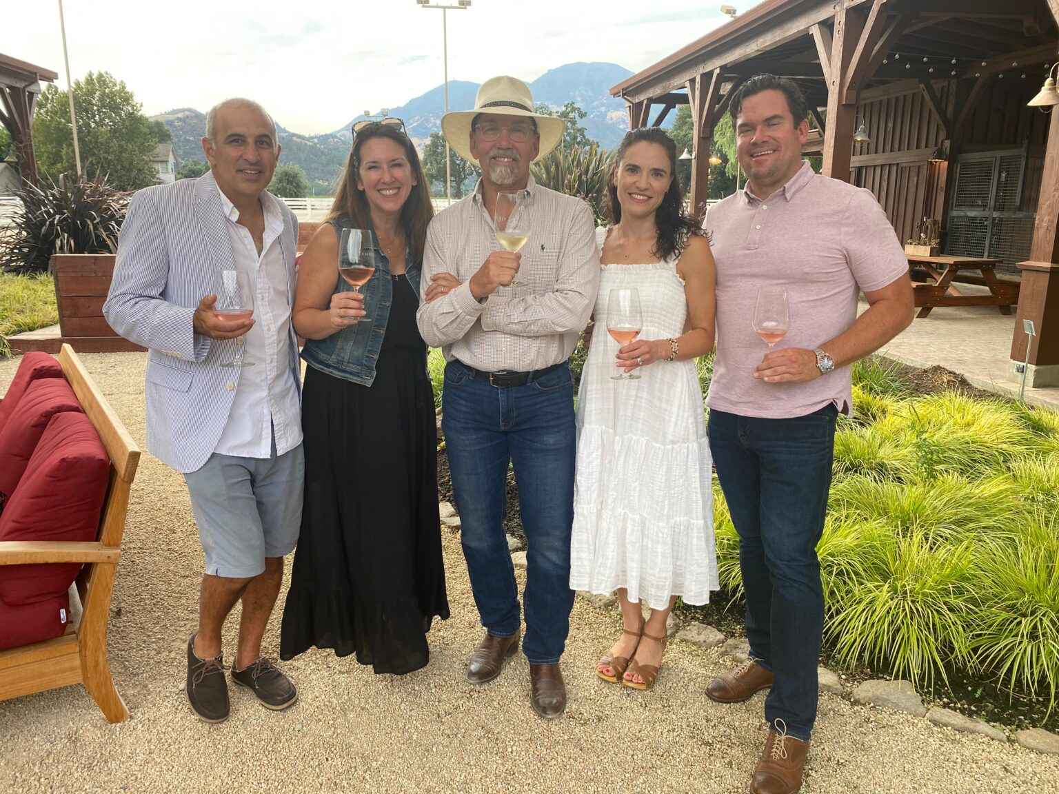 Barry and guests enjoying wine in courtyard